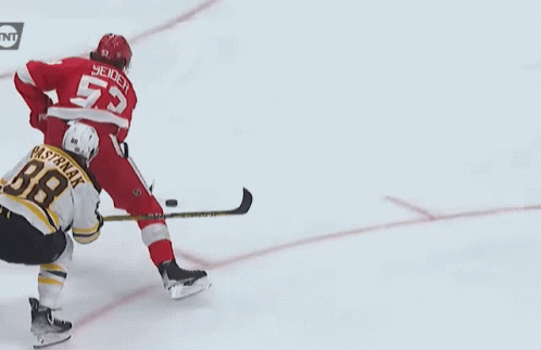 A Hockey Player With The Number 55 On His Back GIF