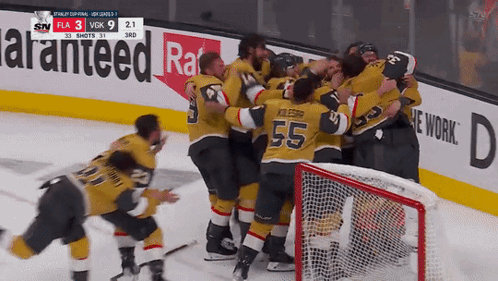 A Hockey Player With The Number 55 On His Jersey Is Hugging His Teammates GIF