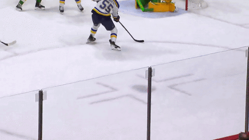 A Hockey Player With The Number 55 On His Shirt GIF