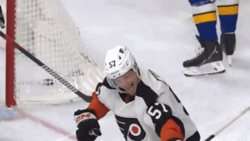 A Hockey Player With The Number 57 On His Shirt GIF