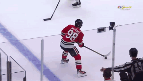A Hockey Player With The Number 68 On His Shirt GIF