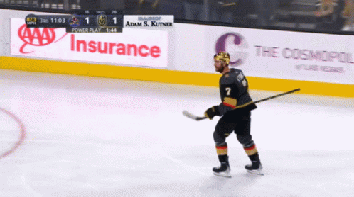 A Hockey Player With The Number 7 On His Jersey Stands On The Ice GIF