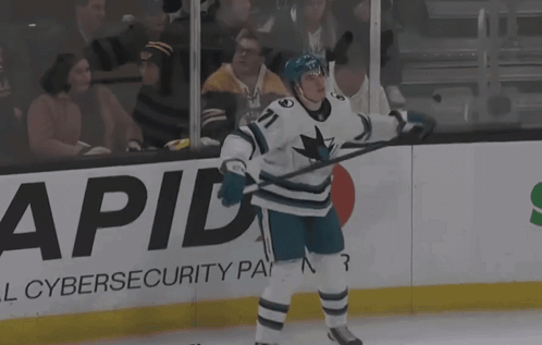 A Hockey Player With The Number 71 On His Jersey Stands On The Ice GIF