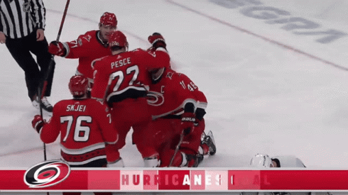 A Hockey Player With The Number 76 On His Jersey Is Surrounded By His Teammates GIF