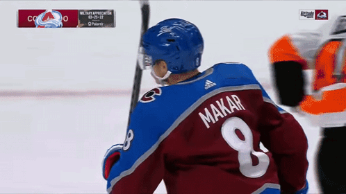 a hockey player with the number 8 on his jersey
