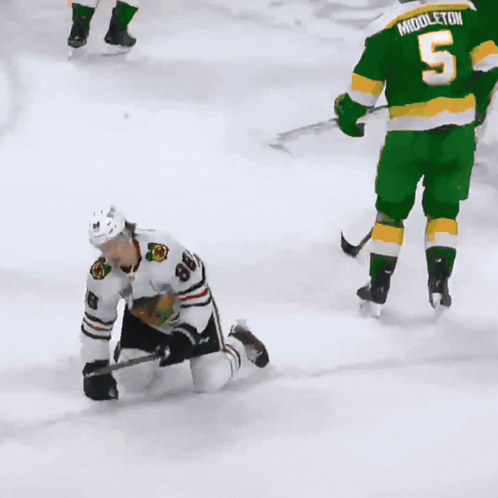 A Hockey Player With The Number 8 On His Jersey Is Kneeling On The Ice GIF