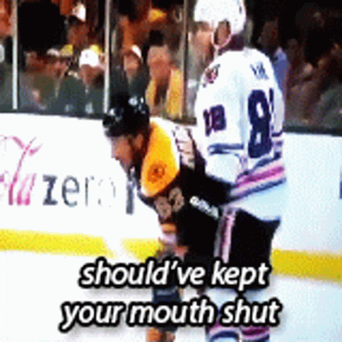 A Hockey Player With The Number 8 On His Jersey Stands On The Ice GIF