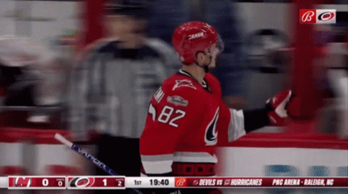 A Hockey Player With The Number 82 On His Shirt GIF