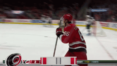 A Hockey Player With The Number 86 On His Back GIF