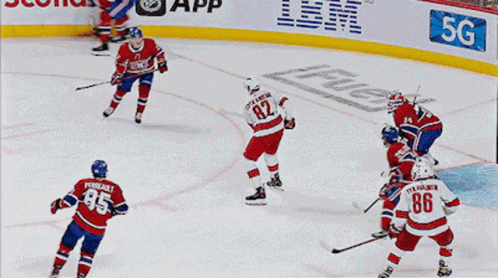 A Hockey Player With The Number 86 On His Jersey Celebrates His Goal GIF