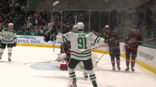 A Hockey Player With The Number 91 On His Jersey Stands On The Ice GIF