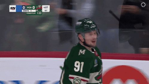 A Hockey Player With The Number 91 On His Jersey Stands On The Ice GIF