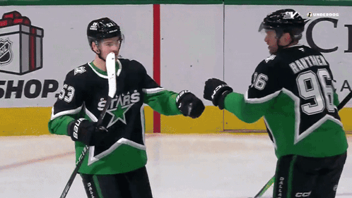 A Hockey Player With The Number 96 On The Back Of His Jersey Shakes Hands With Another Player GIF