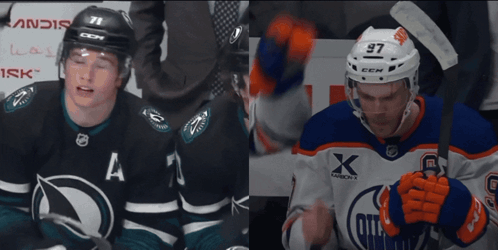A Hockey Player With The Number 97 On His Helmet Stands Next To Another Player GIF