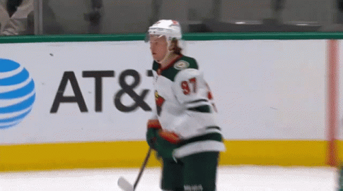 A Hockey Player With The Number 97 On His Jersey Is On The Ice GIF