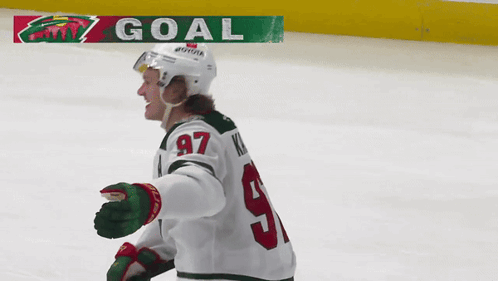 A Hockey Player With The Number 97 On His Shirt GIF