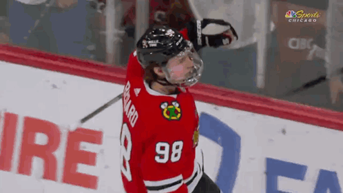 A Hockey Player With The Number 98 On His Shirt GIF