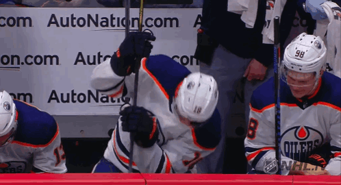 A Hockey Player With The Number 98 On Their Jersey GIF
