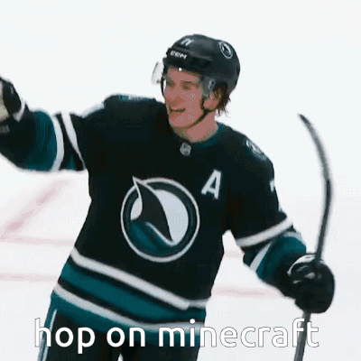 A Hockey Player With The Number A On His Jersey Is Holding A Hockey Stick GIF