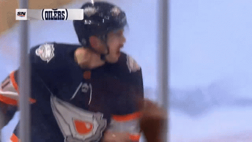 A Hockey Player With The Word Oilers On His Shirt GIF