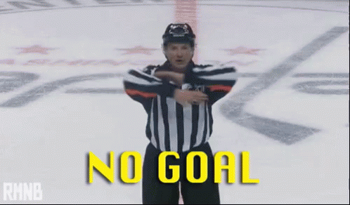 A Hockey Referee With His Arms Outstretched And The Words No Goal Behind Him GIF