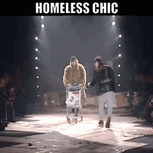 A Homeless Man Pushing A Shopping Cart Down A Runway GIF