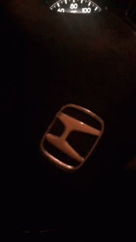 A Honda Emblem Sits Next To The Speedometer GIF
