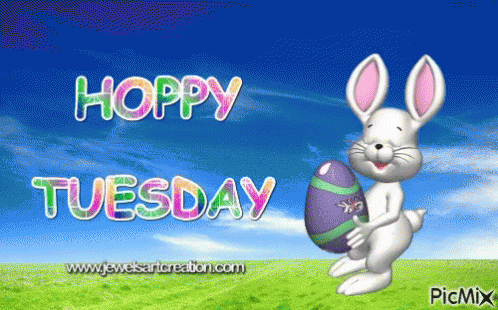A Hoppy Tuesday Greeting Card With A Bunny Holding An Egg GIF