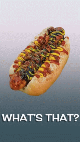 A Hot Dog With Ketchup Mustard And Bacon On A Bun With The Words What 'S That Written Below It GIF