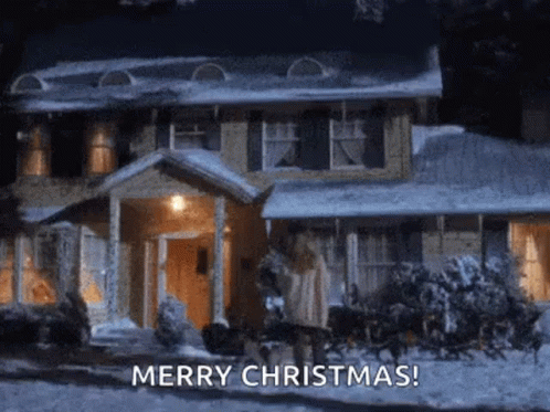 A House Is Covered In Snow At Night And A Sleigh Is Pulling A Christmas Tree . GIF