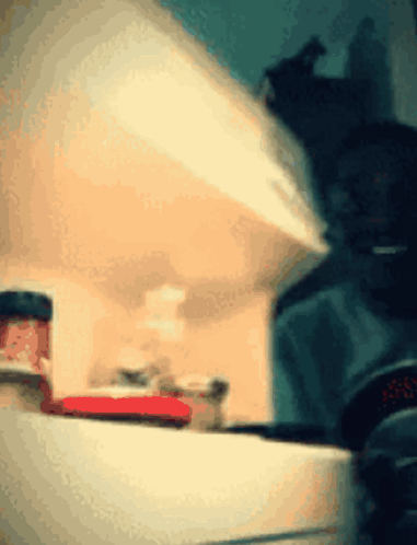A Jar Of Strawberry Jam Sits On A Shelf GIF