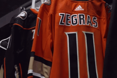 A Jersey That Says Zegras 11 On It GIF
