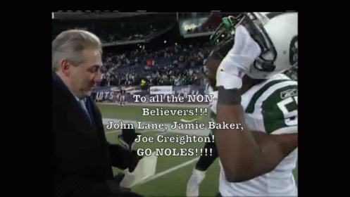a jets football player is being interviewed by a reporter