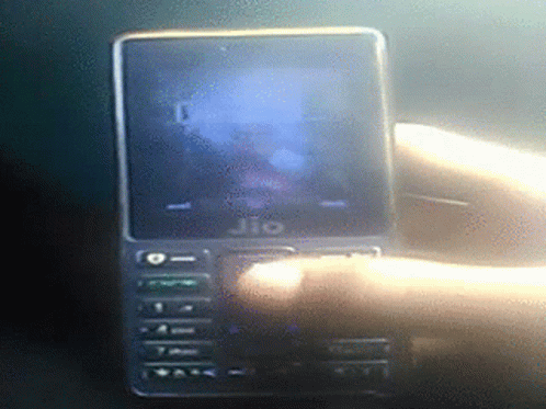 A Jio Phone Is Being Held By A Hand GIF