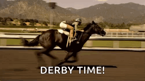 A Jockey Is Riding A Horse On A Race Track With The Words `` Derby Time '' Written Below Him . GIF