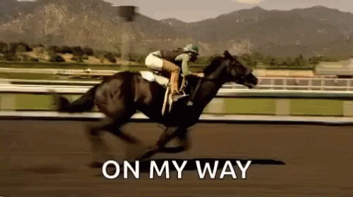 A Jockey Is Riding A Horse On A Race Track With The Words `` On My Way '' Written On The Bottom . GIF