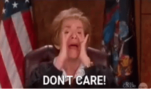 A Judge Is Crying While Sitting In Front Of An American Flag And Says `` Do N't Care '' . GIF
