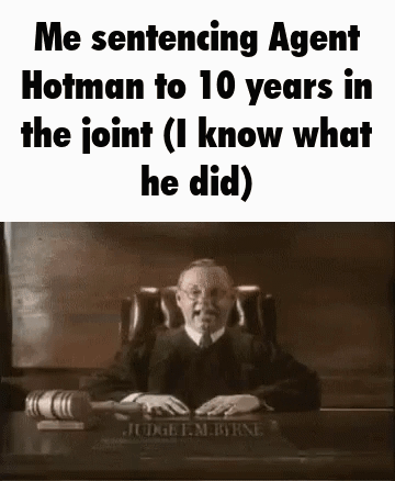 A Judge Is Sitting At A Desk In A Courtroom With A Gavel . GIF