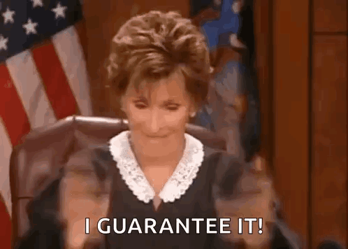 A Judge Is Sitting In A Courtroom With Her Hands In The Air And Saying `` I Guarantee It '' . GIF