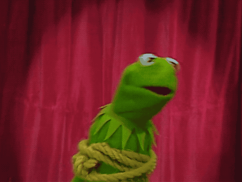 A Kermit The Frog Is Tied Up With A Rope GIF