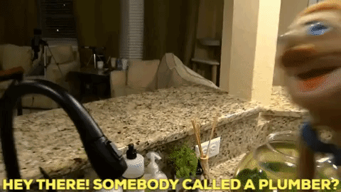 A Kitchen Counter With The Words Hey There Somebody Called A Plumber Above It GIF