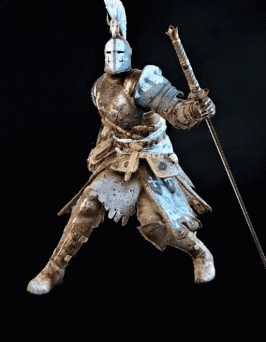 A Knight In Armor Is Holding A Long Sword GIF