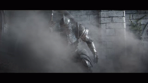A Knight In Armor Is Holding A Spear In A Foggy Room GIF