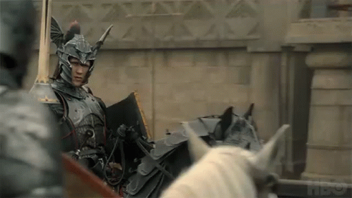 a knight in armor is riding a horse drawn carriage .