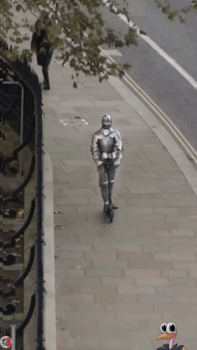 A Knight In Armor Is Walking Down The Street With A Turkey In The Background GIF