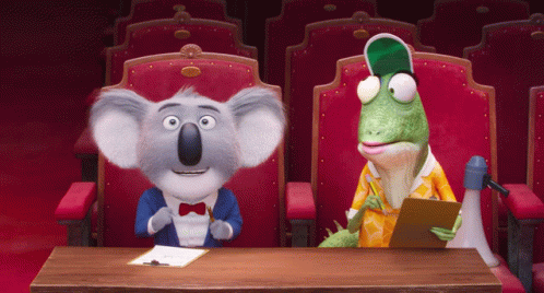 A Koala Bear And A Lizard Sit At A Table GIF