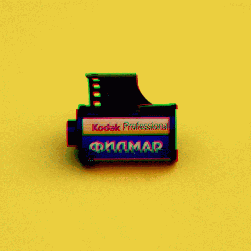A Kodak Professional Film On A Yellow Surface GIF