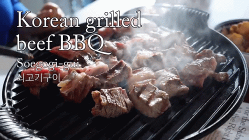 A Korean Grilled Beef Bbq Being Cooked On A Grill GIF
