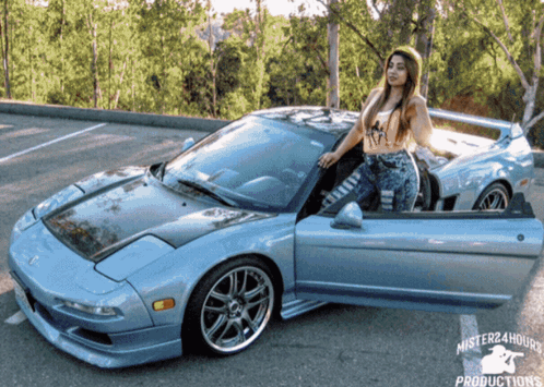 A Lady Is Standing Next To A Car That Says Mister24hours Productions GIF