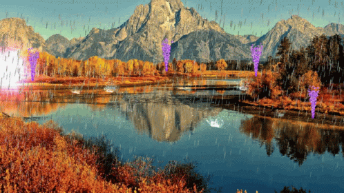 A Lake With Mountains In The Background And Rain Coming Down GIF